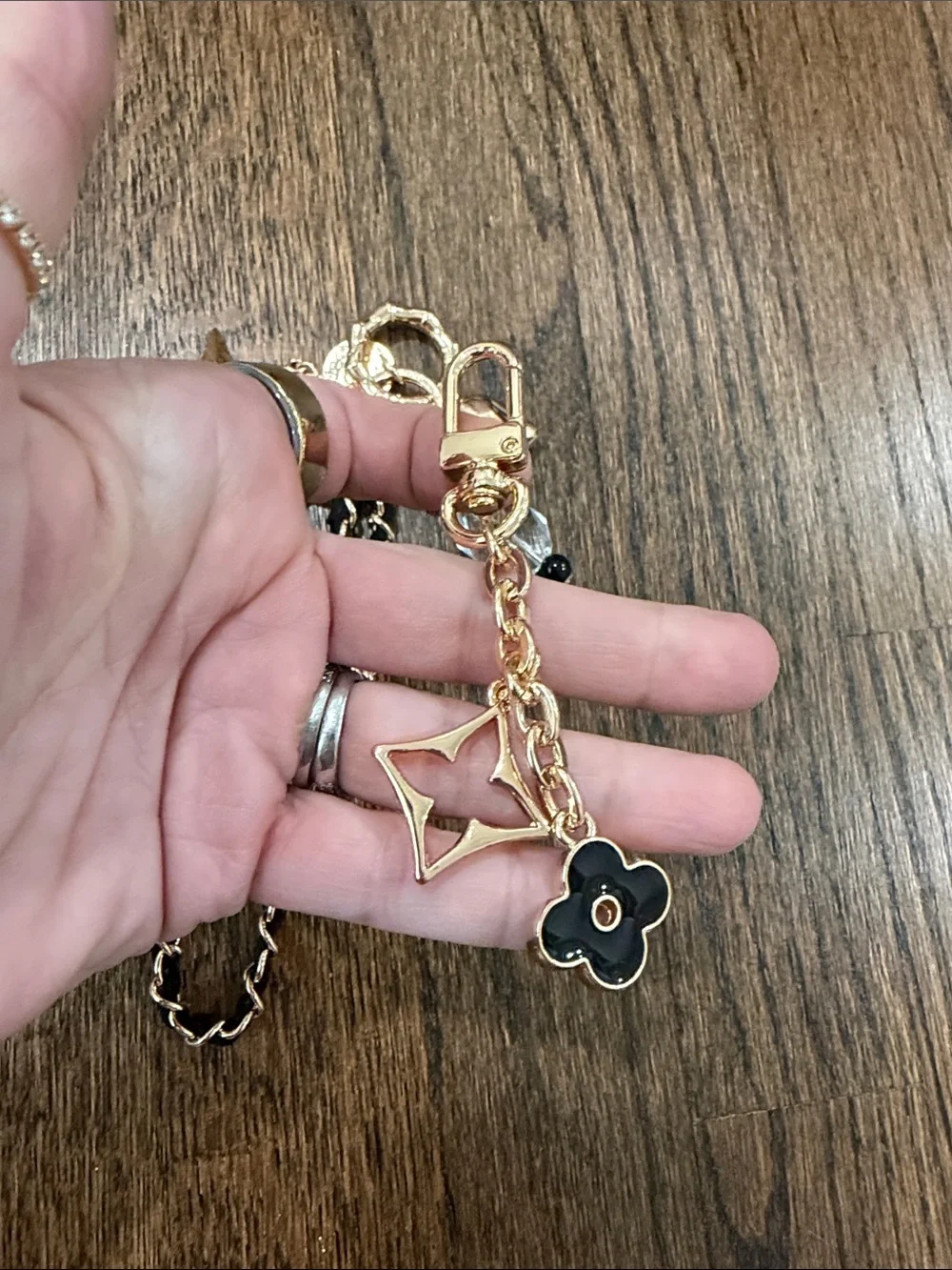 Set of 2 bag charms- Gold and Black Charm Keychain with Star & Flower Accents